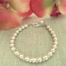 Eleganta baltas vai krēmkrāsas pērļu rokassprādze ar Swarovski kristāliem AB 6mm Eleganta baltas vai krēmkrāsas pērļu rokassprādze ar Swarovski kristāliem AB 6mm